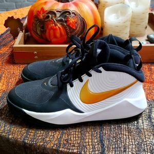 New Nike basketball sneakers white black and gold.